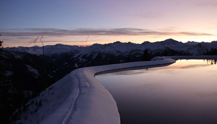 Sonnenuntergang am Spiegelsee bei Wintereinbruch